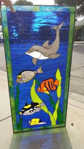 I think the fish should be wary of the dolphin. But this is a beautiful work of art. Love the blue sea.