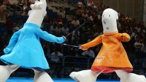 From SBNation: "This looks like one of those weird "adult comic strips" that you might nervously leaf through in the "sex" section of a library or bookstore when you're in grade school. It also kind of looks like if Keith Haring drew a guest strip of "Life in Hell." Either way, this is so, so weird. Two bizarre, bottom-heavy weirdos with five-inch arms holding hands and stumbling around Athens together. If you saw these things out on the street you'd have to admonish your children not to openly gawk."