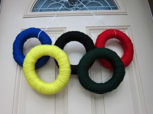 This is a yarn Olympic wreath. Each ring is wrapped in a different color. And they're all held up by a single string.