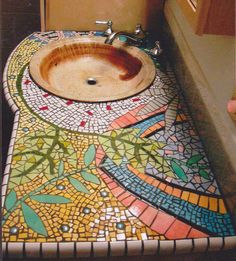 Then again, ceramic tiles tend to be in most bathrooms. Yet, this mosaic counter is probably not cheap in the least.