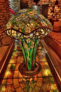 Yes, that's a stained glass lamp all right. And on a stained glass table, too. Not sure if it's a Tiffany though.
