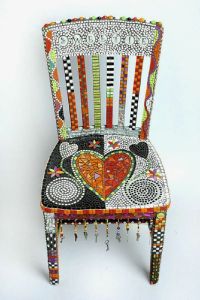 Yes, it's another mosaic chair. But this is in a very different style than the last one. And it has a few hearts to it.