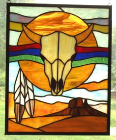 This depicts a longhorn with Indian feathers on a desert scene. You can't get more Southwest than that.