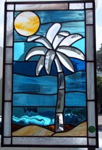 Beach scenes are fairly common stained glass motifs for some reason. Not sure why.
