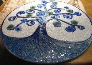 Almost seems like an embroidery sampler. However, it's probably made from glass and tile as I can see.