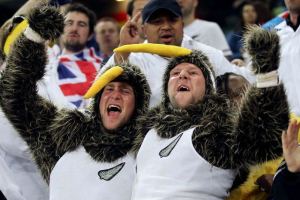 Because they're dressed like a couple of kiwis. And I know the kiwi is a symbol for that country. Might've been cooler if they came as Hobbits.