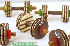Made with chocolate pretzel sticks, shortbread cookies, and lifesavers. Easier to make than lifting big weights in the weightlifting competition.