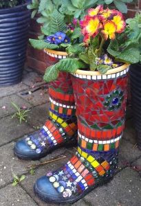 Yet, they also have lovely mosaic decoration on them. Also like the flowers in them. Yes, these are boot planters.