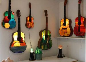 I don't think these guitars are for playing since they light up and are made of glass. But I couldn't pass these up.