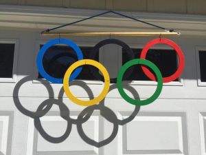 Not sure if the rings are made from metal. Not sure if I'd want this hanging over a garage either. Yet, it casts a nice shadow.