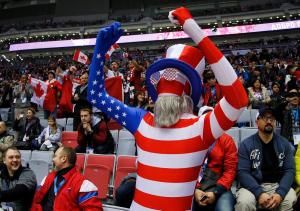 Here he is in an American flag suit as well as his hat, glasses, and beard. And he's really getting into it.