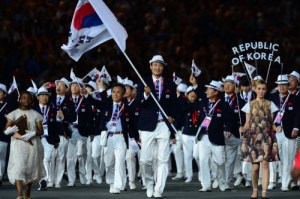 Had they waited until 2016 to wear these, they would've been appropriately dressed. But no, South Korea isn't known for their Panama hats.