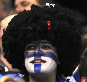 I know the guy's wearing a wig. But he also has his face painted in the Finnish flag.