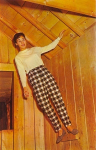 I doubt that she's managed to defy gravity. However, her checkered pants seem to defy fashion.