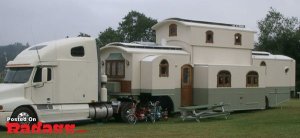 Yes, this is a camper shaped like a house. Not sure about the architectural style here.