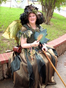 She even has a green dress and is holding a leaf that seems to be changing color. Guess fall must be around the corner.