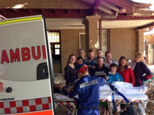Guy being taken into an ambulance: Not funny. Family posing for a vacation photo while a guy's being taken into an ambulance: hilarious.