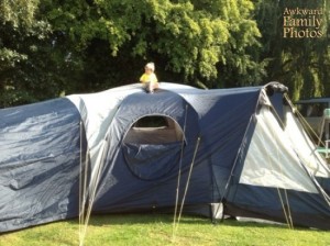 In reality, the kid was on the tent, not in the tent. Still, someone get him off there.