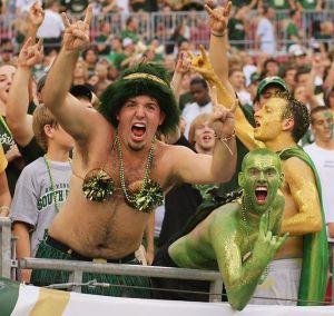 Of course, these guys consist of two men in sparkly body paint an a guy in a grass skirt and pom pom bra. Yes, you have fans like that.