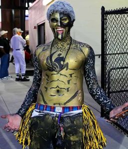 Like the navy blue touches, blue wig, and pom poms. This guy has great talent. Must be a repressed art major.
