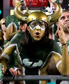 And she has a horn hat as well as painted her whole body to prove it. Okay, she's wearing a camisole, but still. This is over the top.