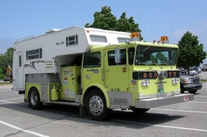 Okay, maybe they do. But it's funny how this camper is attached to a fire truck. And not a red one.