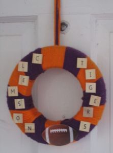 I think this person used letter tiles for this. Gives the wreath its whimsical charm.