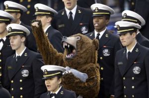 Luckily for them, it's a guy in a bear costume. But I love how he seems to be cheering on in the stands.