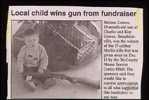 At first, I thought the firearm in question might be a BB gun. Turns out it's a real gun which just begs the question: How in the hell did a baby manage to win this? I mean this very picture pretty much sums up why I staunchly support gun control.