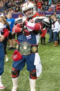Yes, that's a guy in football gear and coveralls. Don't ask me how he got that idea. But he makes it work.