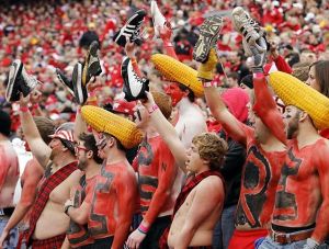 Nebraska's team is the Huskers. And yes, some of them wear corn heads which I think is ridiculous. But the shoe thing speaks for itself.