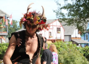 Sure he looks like a faun or satyr. But the guy is wearing antlers. So it may be hard to say at any length.
