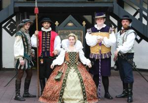 Guess this is the court of Queen Elizabeth I. And probably before the Armada as well. Or she's wearing a scaled down outfit.