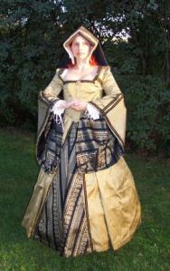 You've probably seen a dress in a painting of one of Henry VIII's wives. Wonder if this woman is playing Katherine of Aragon.