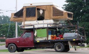 Well, the tent camper looks pretty normal sans the wheels. But this seems to be pretty crazy to put it on the roof of a truck.