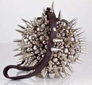 On the bright side, it might deter purse snatchers which helps if you're in a very bad neighborhood. However, the spikes are probably not very sharp.