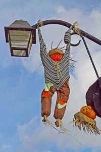 Yes, these scarecrows are definitely hanging there. Guess they have all night party hijinks, too. Figures.