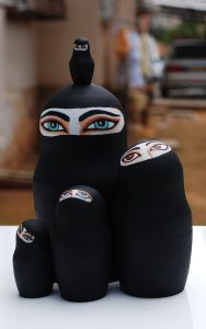 These are nesting dolls of Muslim women in the Middle East. Well, at least ones wearing a chador that only shows the eyes.