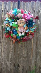 It's made from different deco mesh colors. And it features plush Kermit and Miss Piggy. So cute.