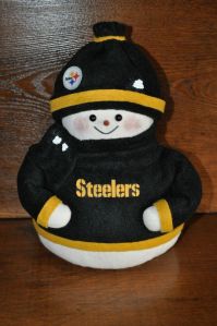 Yes, this little guy is made of cloth and donning the black and gold. So adorable.