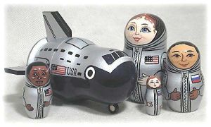 Yes, it's a crew of 4. But the largest doll is a shuttle. How cool is that?