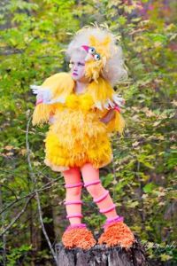 For some reason, I think this is more of a mashup costume between Big Bird and Effie Trinket. Hell, this girl almost seems like she's about to choose District 12 tributes for the Hunger Games. Like she's saying, "Primrose Everdeen."