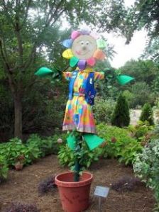 Helps that she seems to spring from a pot in a flowery dress. Love the rainbow petals.