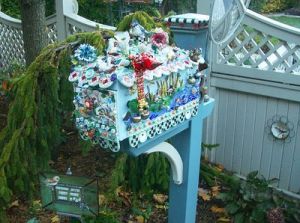 This one seems to have a lovely painting and a lot of flowery touches. Definitely not one you'd want in my neighborhood (because it might get smashed).