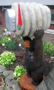 Didn't know you can have wood sculpture mailboxes. Not sure how that works. But this is quite clever.