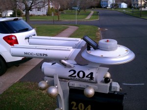 Yes, this is a mailbox depicting the Enterprise from Star Trek which is set at a time when nobody uses mailboxes at all. Seriously, they have replicators and teleport technology.