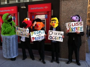 The letter of the day is "C" for "class warfare." The number of the day is 99 for "We are the 99%." 