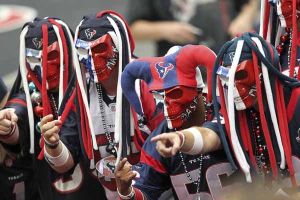 These Houston Texans fans wear skull masks and funny hats. But they take their team so seriously that you should be wary to laugh in front of them in their silly costumes.