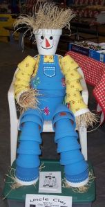 After all, he's made from a lot of flower pots that were probably sold at discount prices. Like the hay in the hands and head.