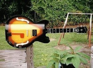 Yes, this mailbox is in the shape of an electric guitar. How cool is that?